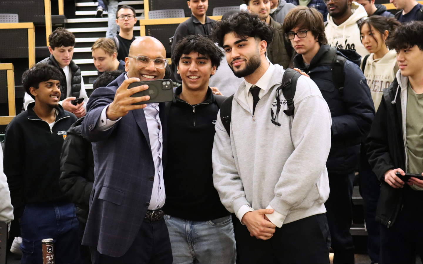 Benjie Thomas taking a selfie with student