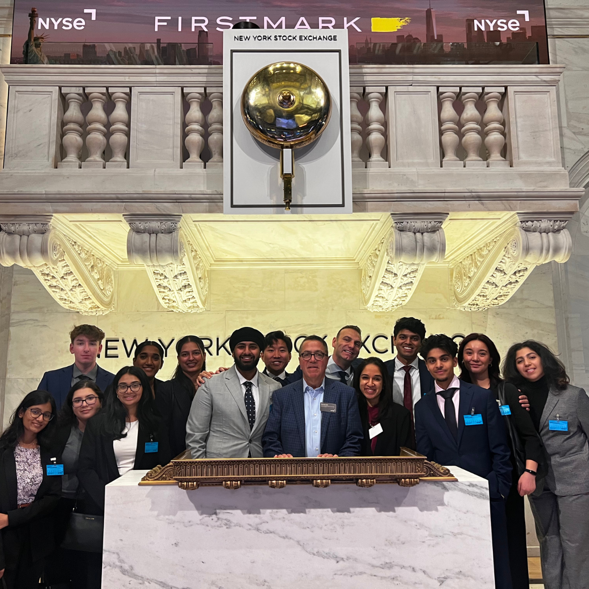 Students pose at of New York Stock Exchange