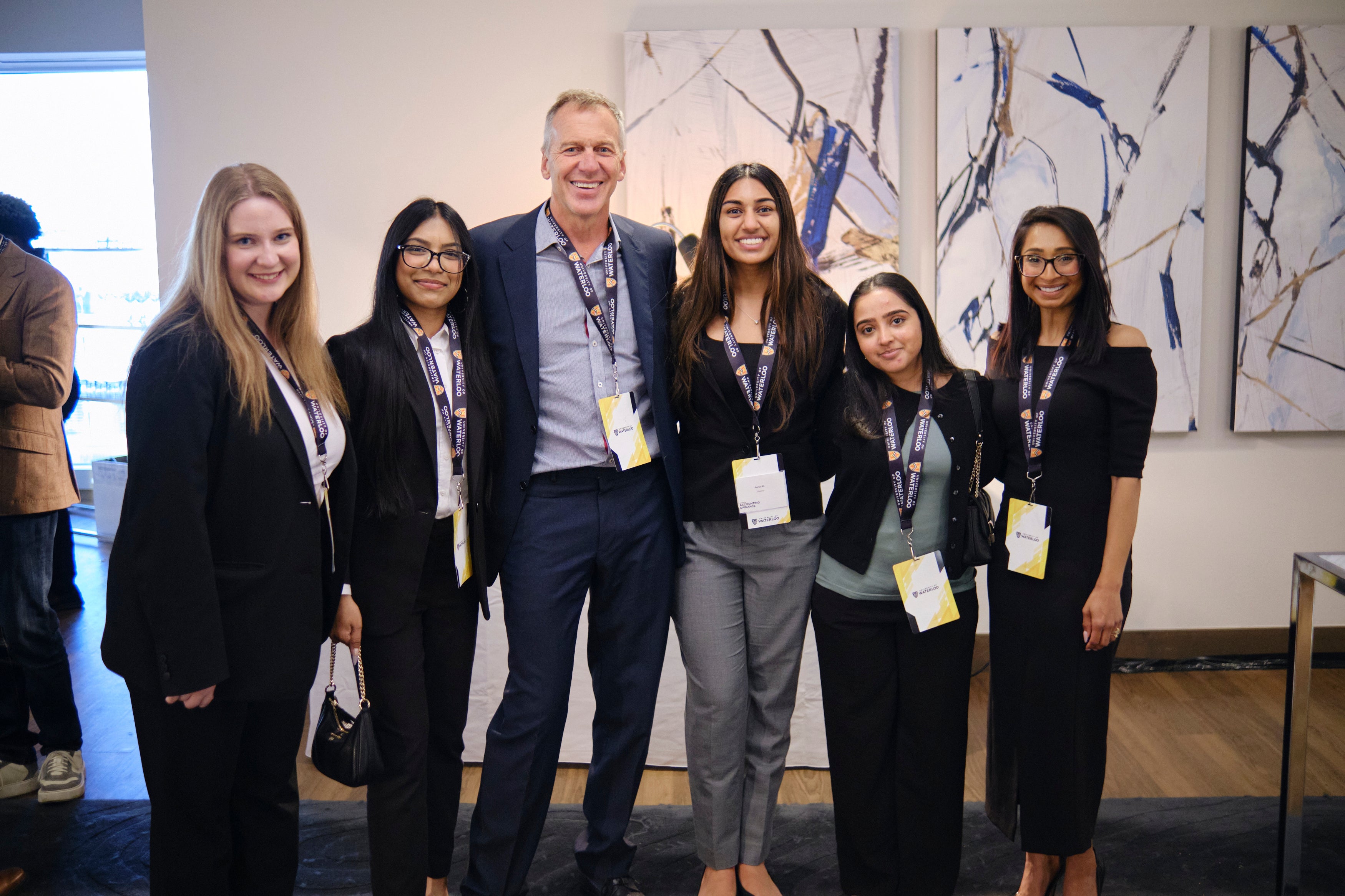 current staff students pose for a photo with gala guests