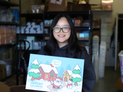 Carol Zou holding a christmas advent calendar