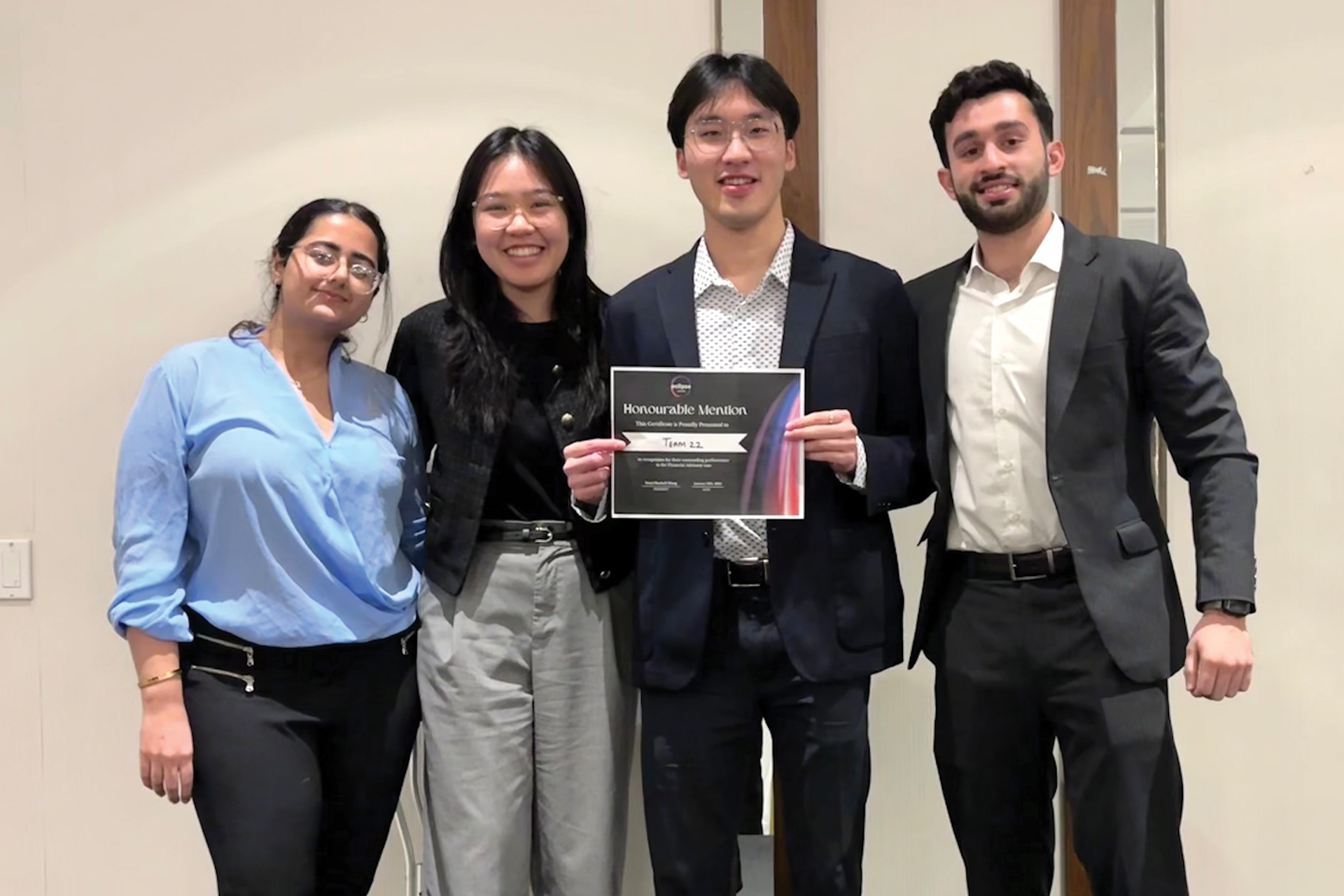 Avika, Vanie, John, and Afnan with an award they won