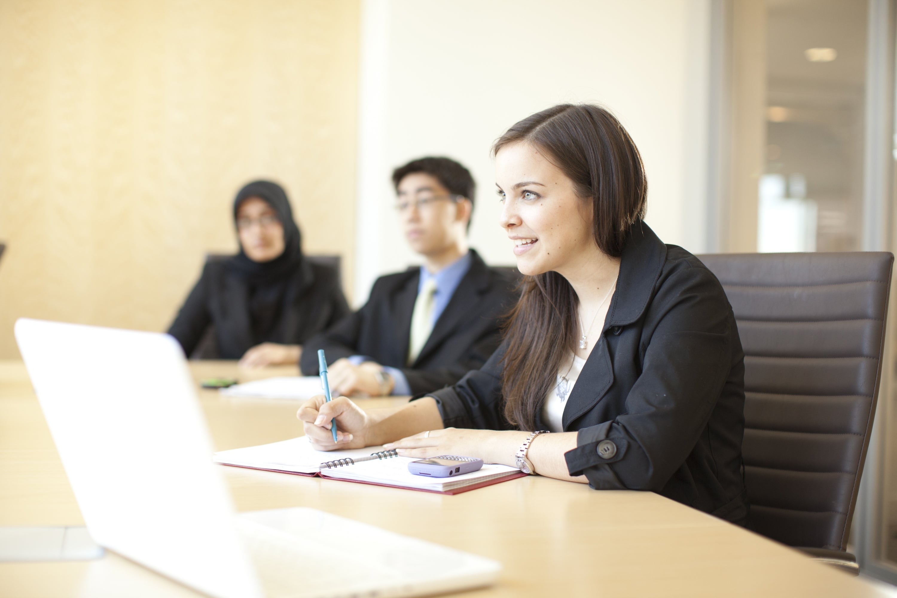 Girl sitting at a desk. 