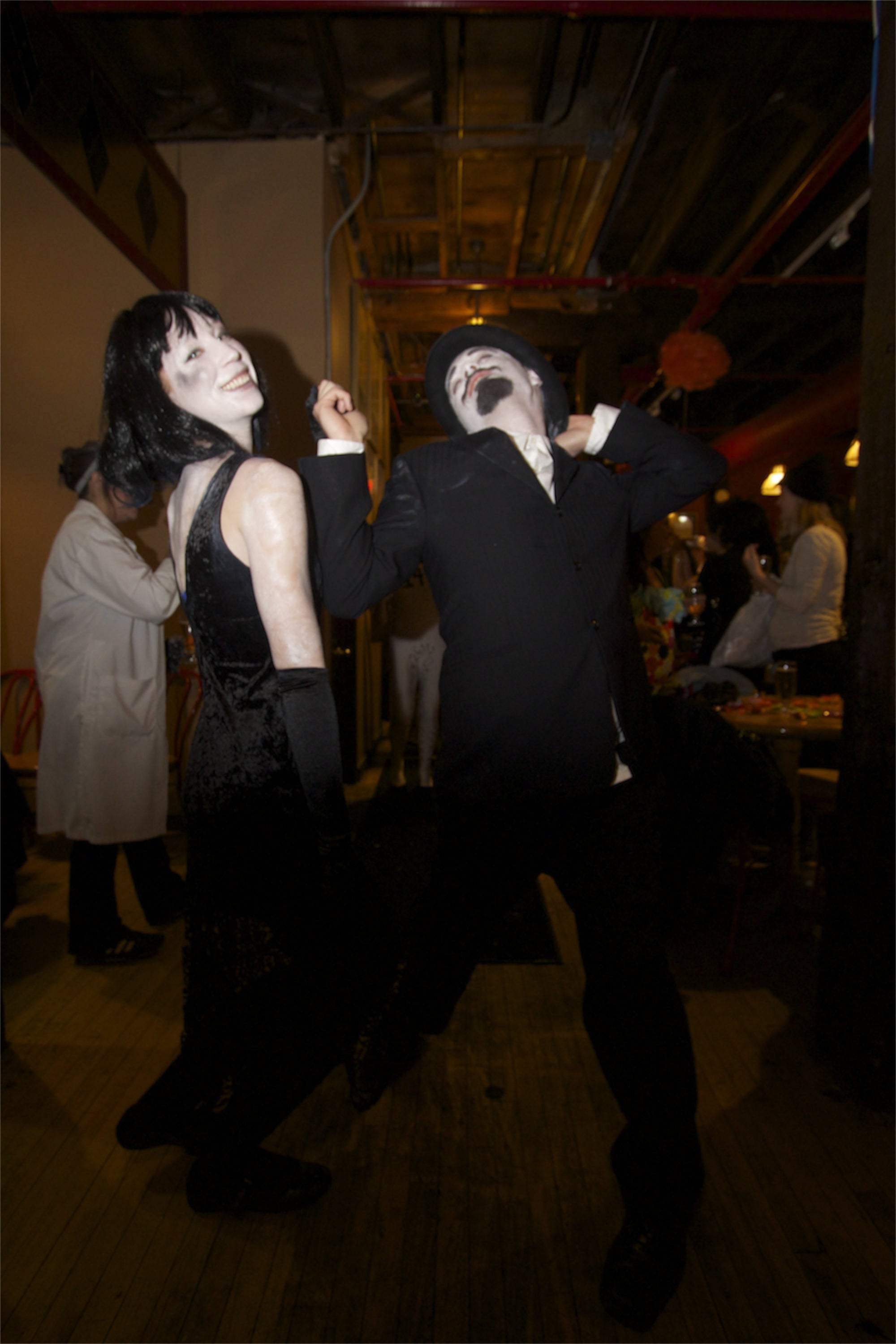Two students dressed as black and white movie actors