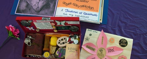 image of treasure box, flower and self-care journal