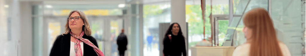 Carla Fehr walking through the STC building