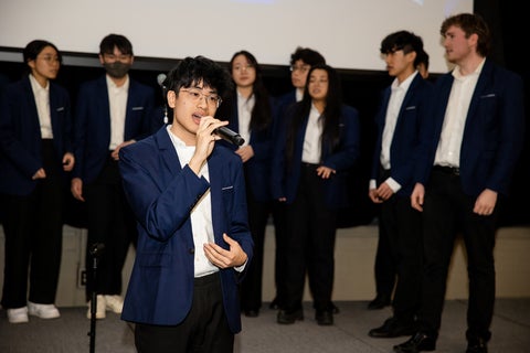 Student group performing in blue blazers