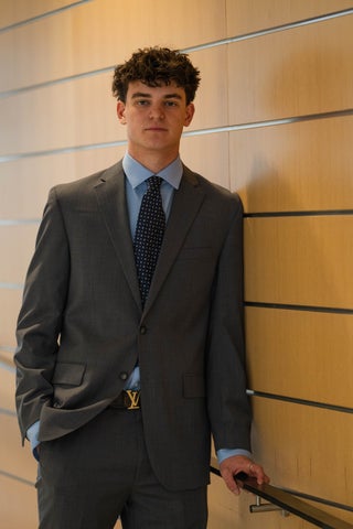 Male business student posing seriously