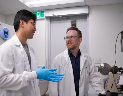 Dale Martin and a graduate student in the lab