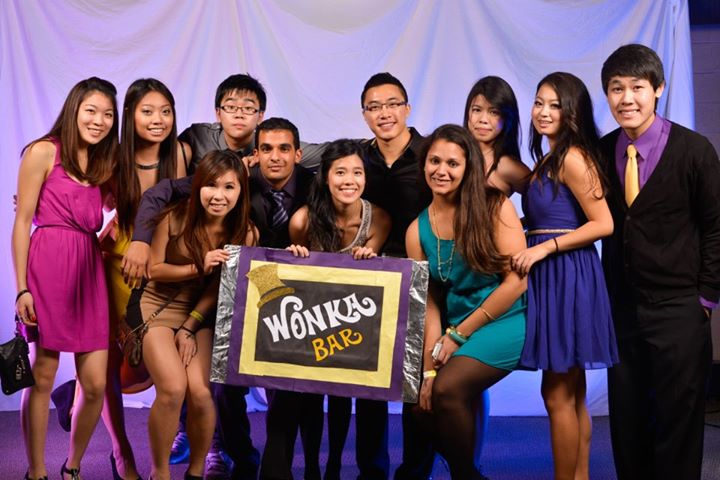 Sci soc group photo holding a giant wonka bar