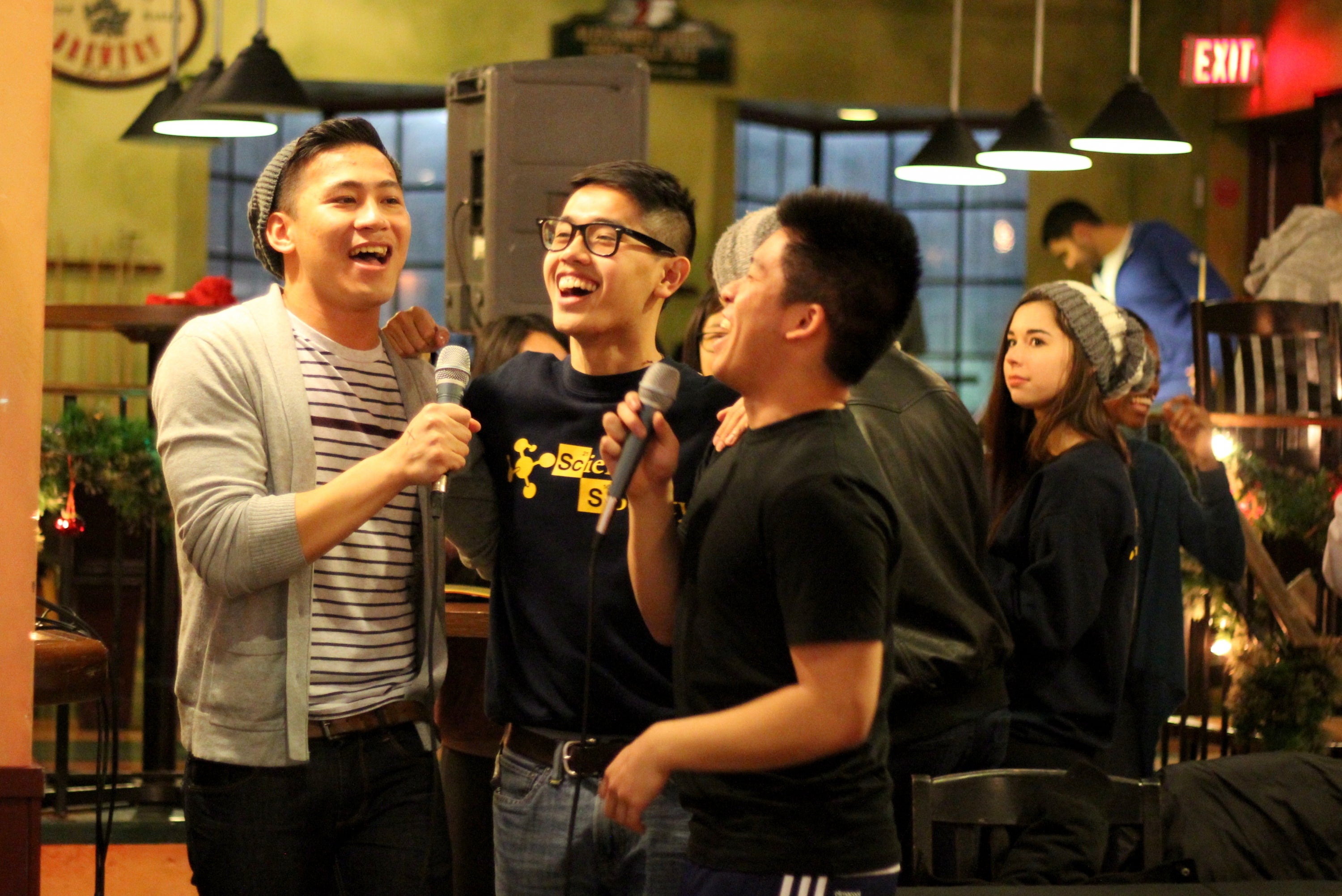 Group of students singing karaoke at End of Term event.