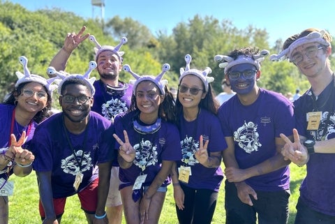 purple orientation team leaders posing