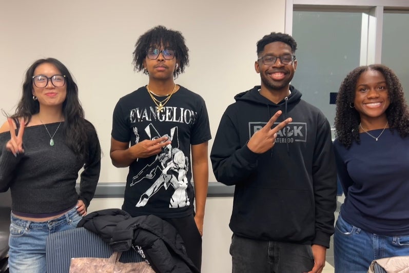 4 students posing together