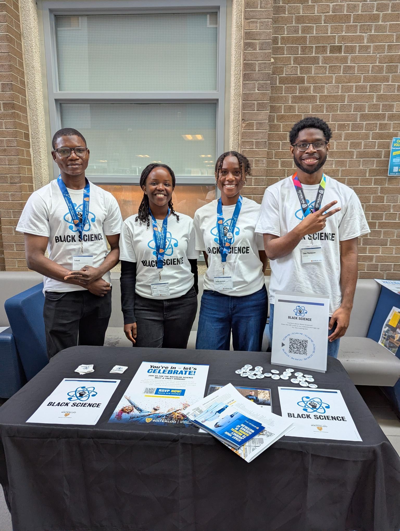 4 Black Science students set up at an information table