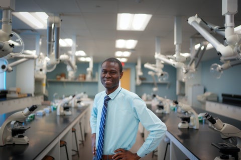 Abiola Olatian poses in lab.