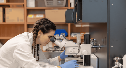 Science student conducting research in a lab.