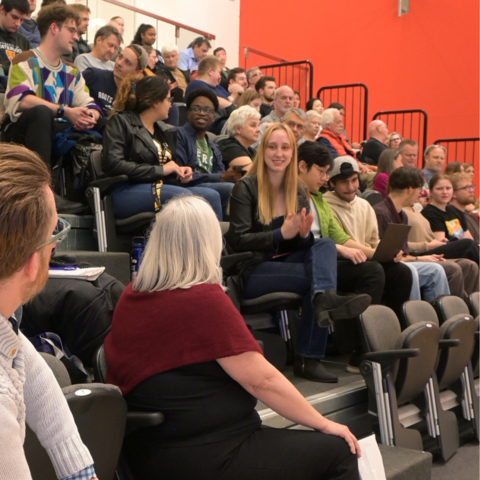 The audience at Travis Craddock's talk, engaged in discussions