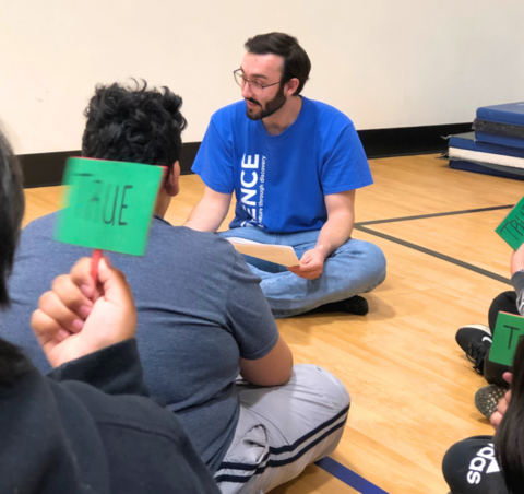 Liam Blaquiere speaking with students.