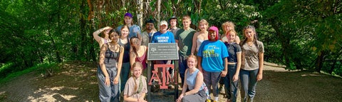 Dean Chris Houser at the Houser Trail in Costa Rica with a group of undergraduate students.
