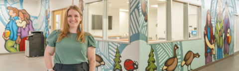 Savannah Sloat standing in front of the Science Indigenous Office at the University of Waterloo.