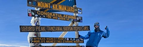 Sierra Jess at the peak of Mount Kilimanjaro