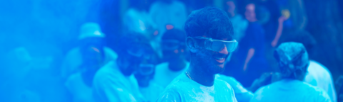 Science students in a smoke of blue powder