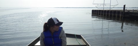 Rebecca Rooney in a boat looking to the right