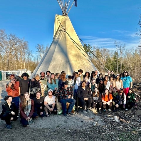 Students outside of the teaching lodge at the 2025 offering of SCI 211