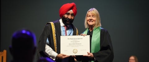 Dr. Jagdeep Singh Bachher and Marianne Vandergreindt at Convocation Fall 2025