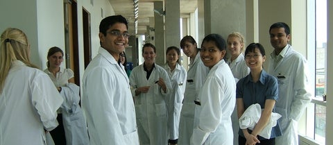 Students in lab coats.