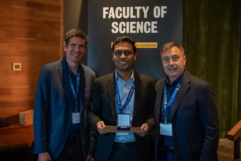 Science graduate student being presented an award