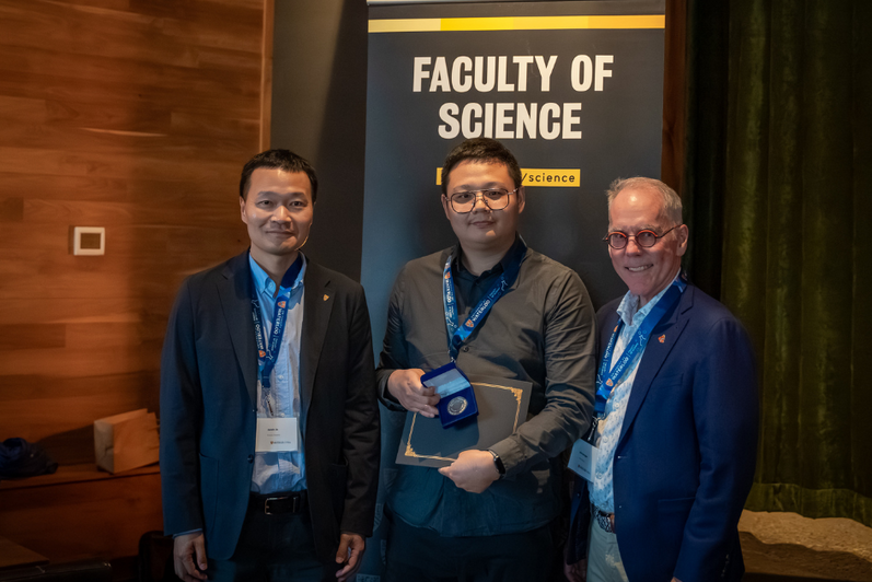 Science graduate student being presented an award