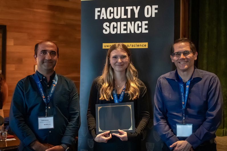 Science graduate student being presented an award