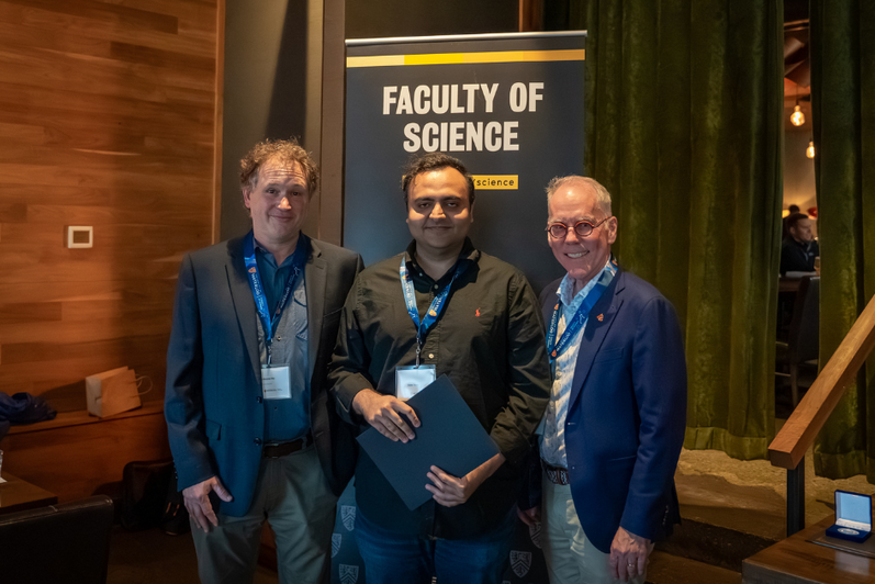 Science graduate student being presented an award