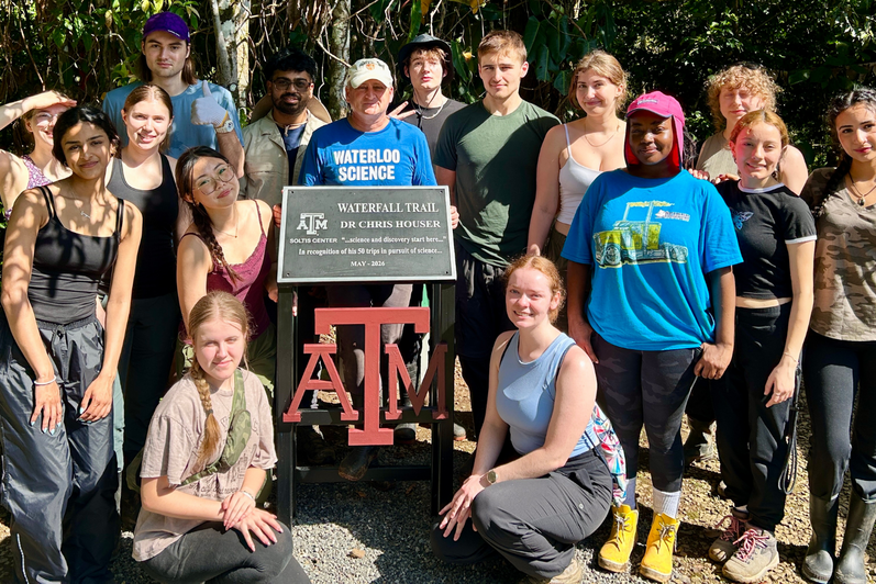 Dean Chris Houser in Costa Rica with students at the Houser waterfall trail.