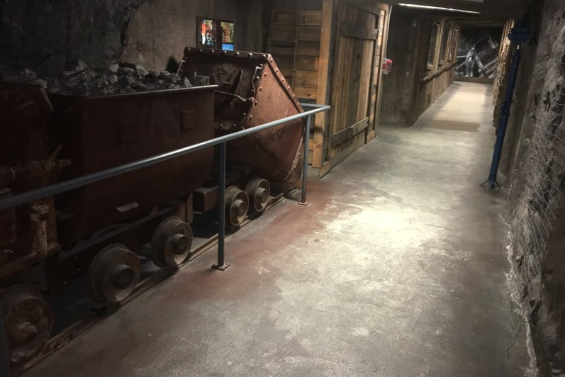 The mining tunnel in EIT, showing a mine cart and rock-covered walls