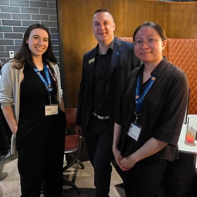 Two event attendees with Graham Murphy, a Waterloo chemistry prof