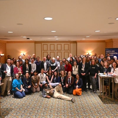 A group of alumni all gathered at the PDAC reception