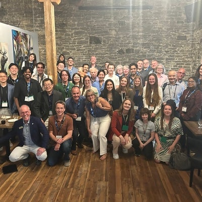 A group of 40 people at an alumni social