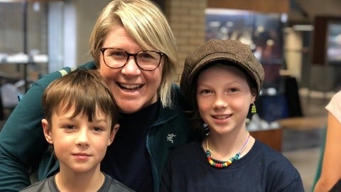 Mom and two kids at the Earth Sciences Family Day event.
