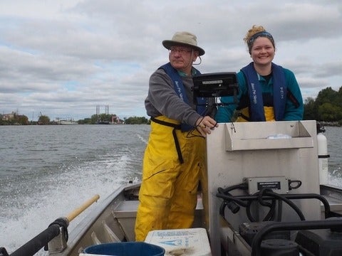 Mark Servos and a grad student on a boat