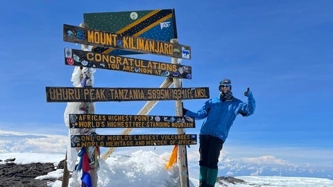 Sierra Jess at the peak of Mount Kilimanjaro