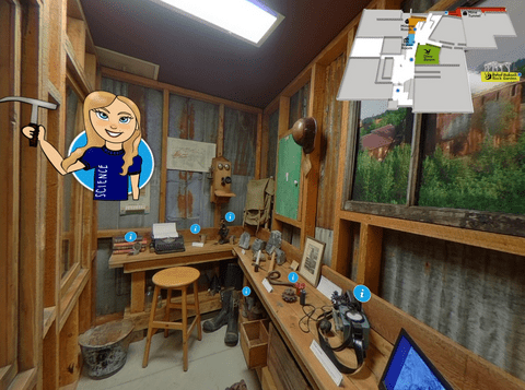 Inside the mining tunnel office. Blue dots indicate places with more information and a cartoon tour guide holds a rock hammer