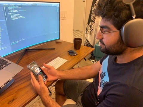 Parshant Utam using the Wombo app on his phone