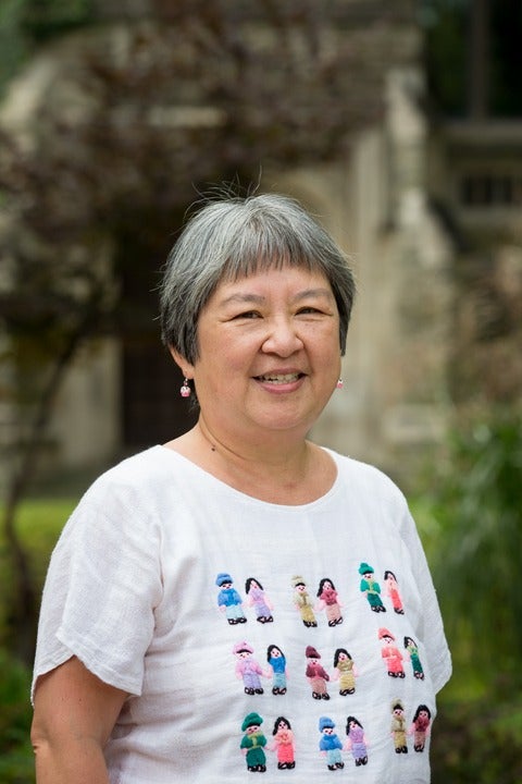 A headshot of Dr. Patricia Chow-Fraser. She is wearing a white t-shirt and is outside with greenery in the background. 