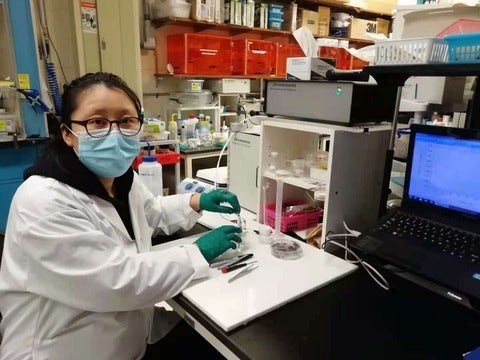 Wenyu Gao with a prototype saliva sensor