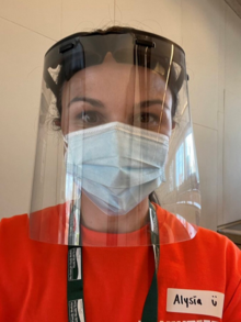 Alysia Kolentsis wearing a mask and face shield