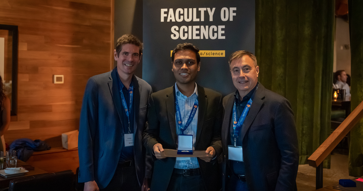 Science graduate student being presented an award