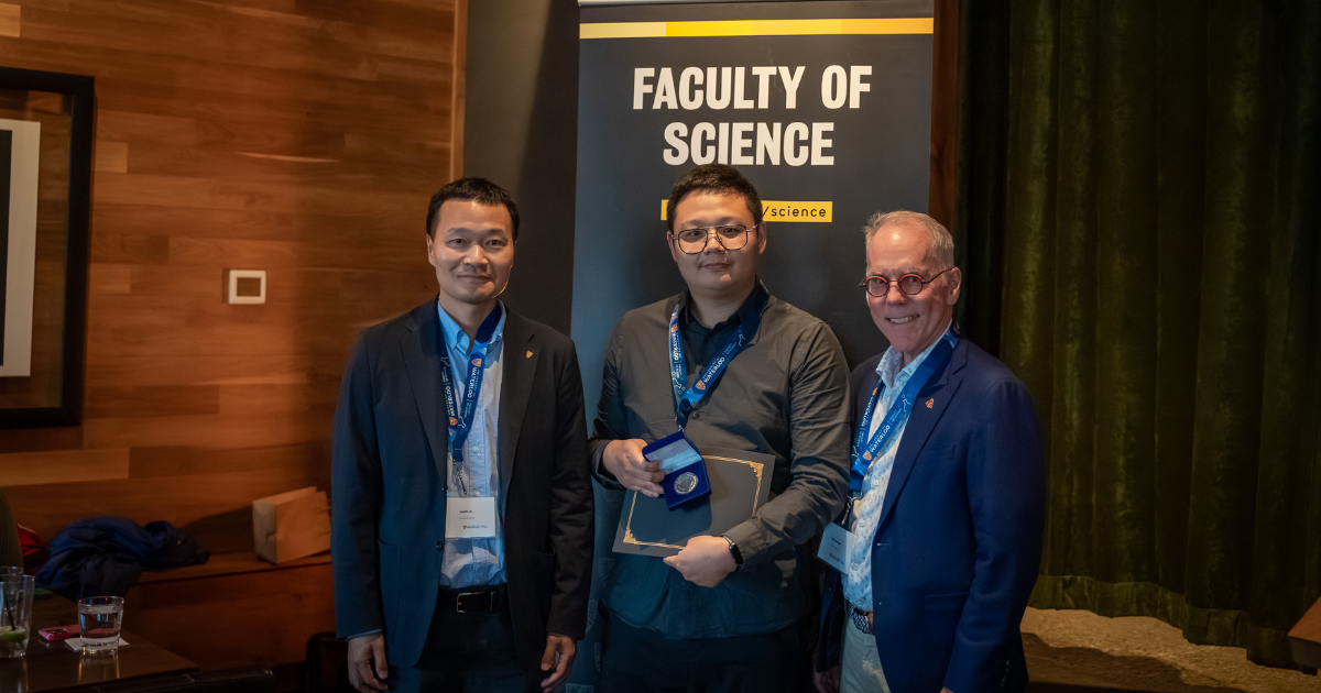 Science graduate student being presented an award