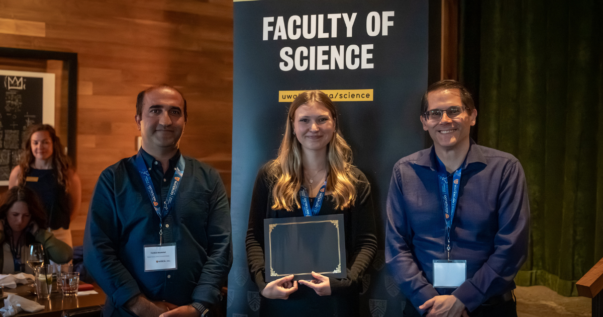 Science graduate student being presented an award