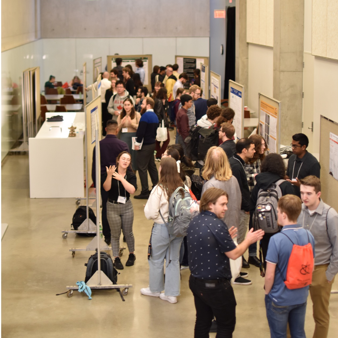 A large hallway full of students and professionals as part of the Canadian Undergraduate Physics Conference. 